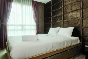 Good Location with Simply Furnished 1BR Apartment Woodland Park Residence By Travelio